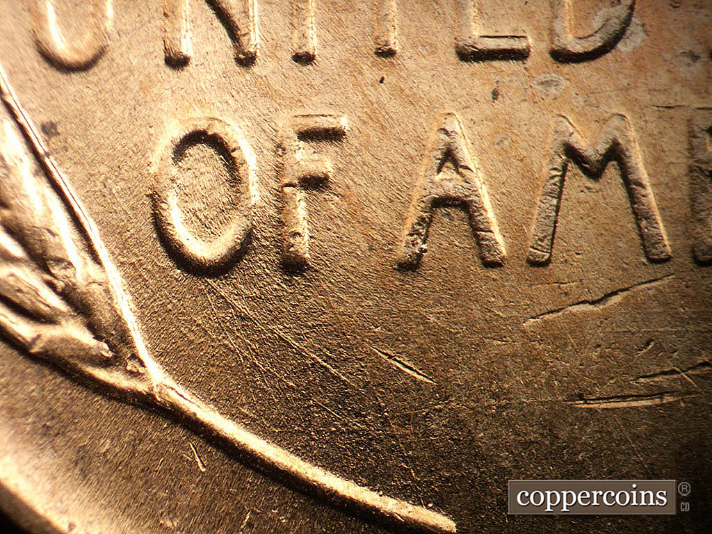 Die-stage B marker on 1956D•1DO•045 showing Heavy SE die scratch from bottom of O in OF.