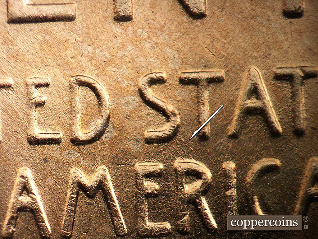 Die-stage B marker on 1956D•1DO•045 showing SE die scratch connects first S in STATES to R in AMERICA.