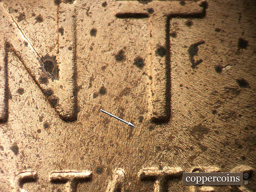 Die-stage B marker on 1956D•1DO•046 showing SW die scratchfrom bottom of T in CENT.
