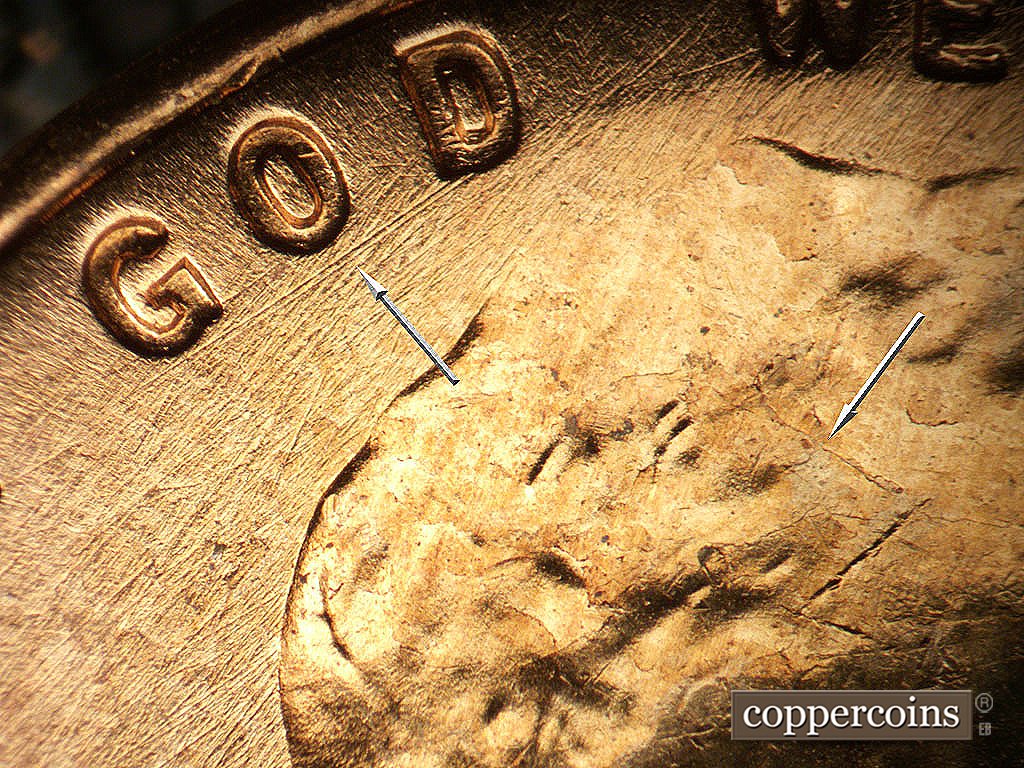 Die-stage B marker on 1956D•1DO•047 showing NE/SW die scratches, Heavy SNE die scratch connects G to D in GOD, die crack in hair.