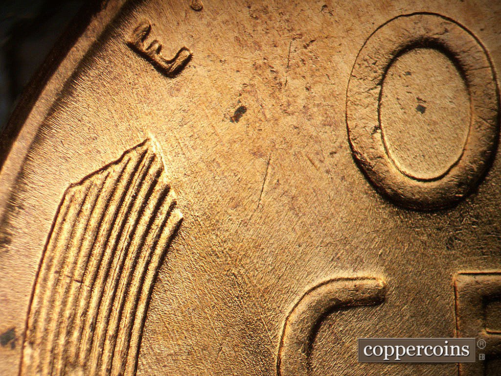 Die-stage B marker on 1956D•1DO•047 showing SE die scrachtes.