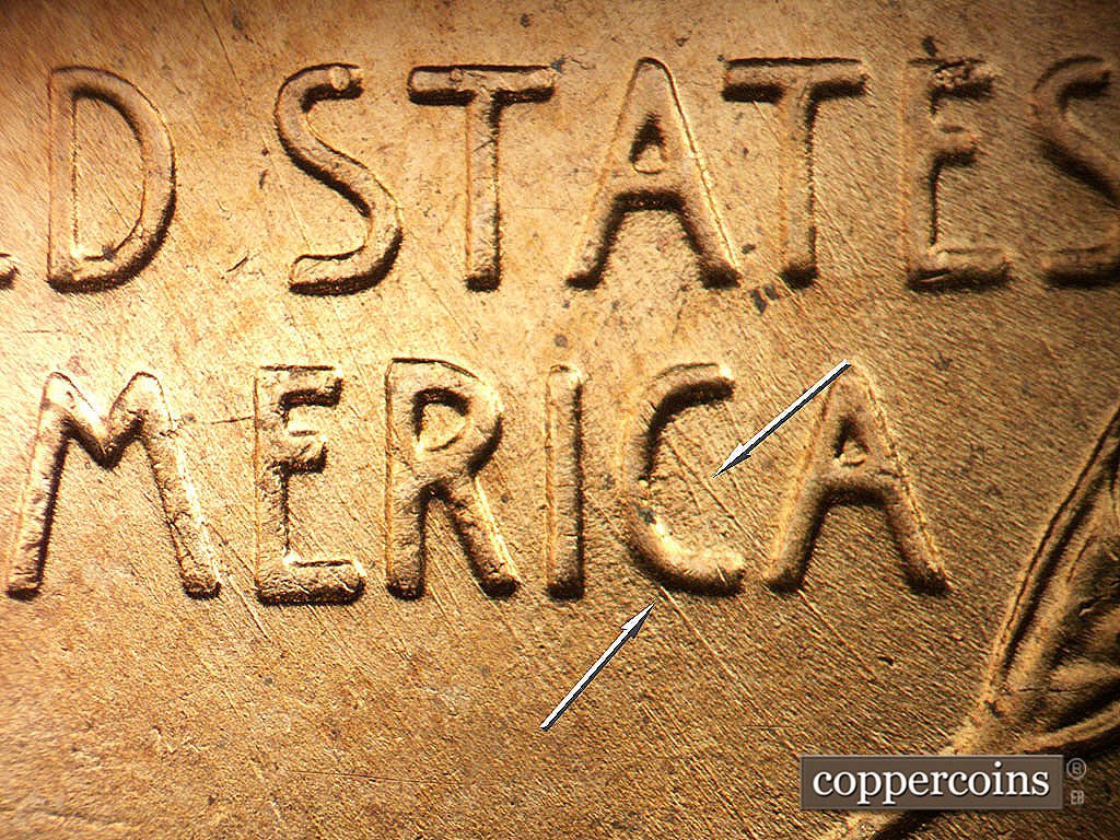 Die-stage B marker on 1956D•1DO•047 showing SE die scratches through UUNITED STATES OF AMERICA. 2 heavier SE die scratches through C in AMERICA.