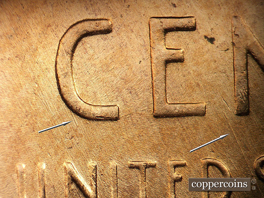 Die-stage B marker on 1956D•1DO•047 showing SE die scratches.