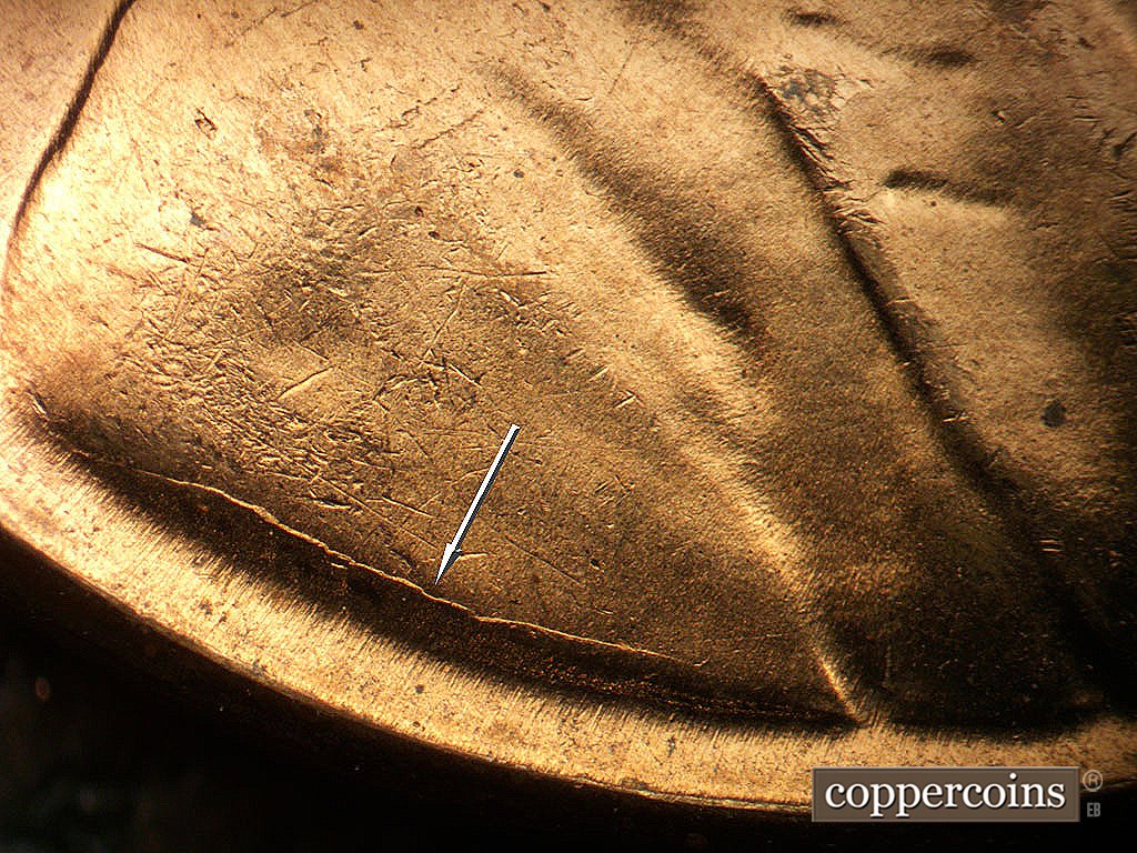 Die-stage B marker on 1956D•1DO•048 showing Die crack above VDB.