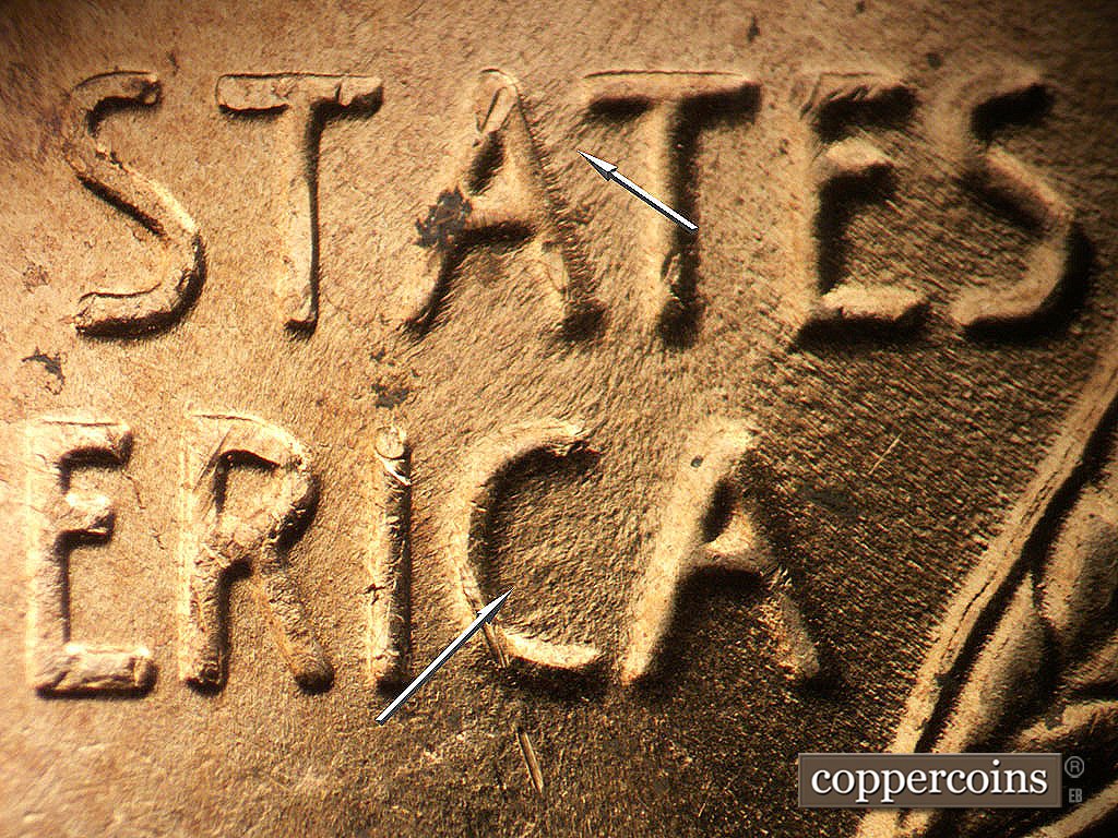 Die-stage B marker on 1956D•1DO•048 showing Die depressions near A in STATES and in C of AMERICA.