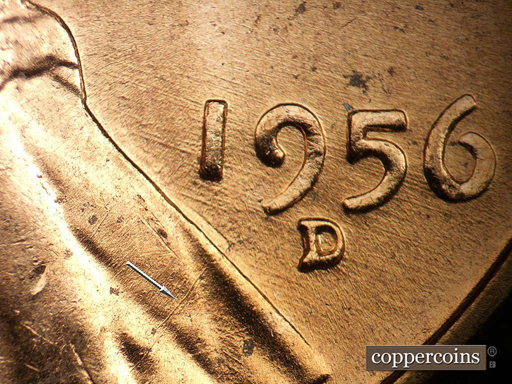 Die-stage B marker on 1956D•1MM•011 showing SW die scratch on lape, SE die scratches through date.
