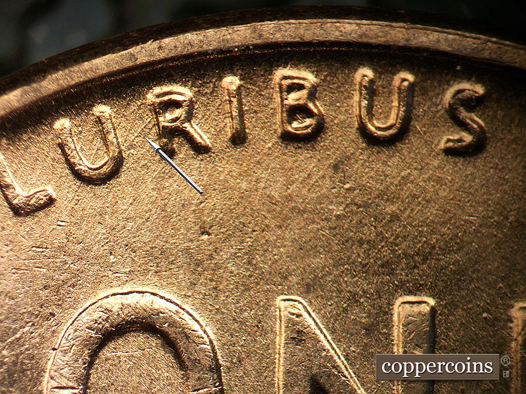 Die-stage B marker on 1956D•1MM•011 showing NE die scratch connect UR in PLURIBUS.