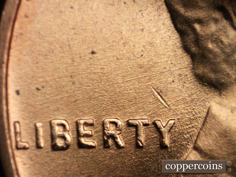 Die-stage B marker on 1956D•1MM•013 (1956 Repunched Mint Mark).