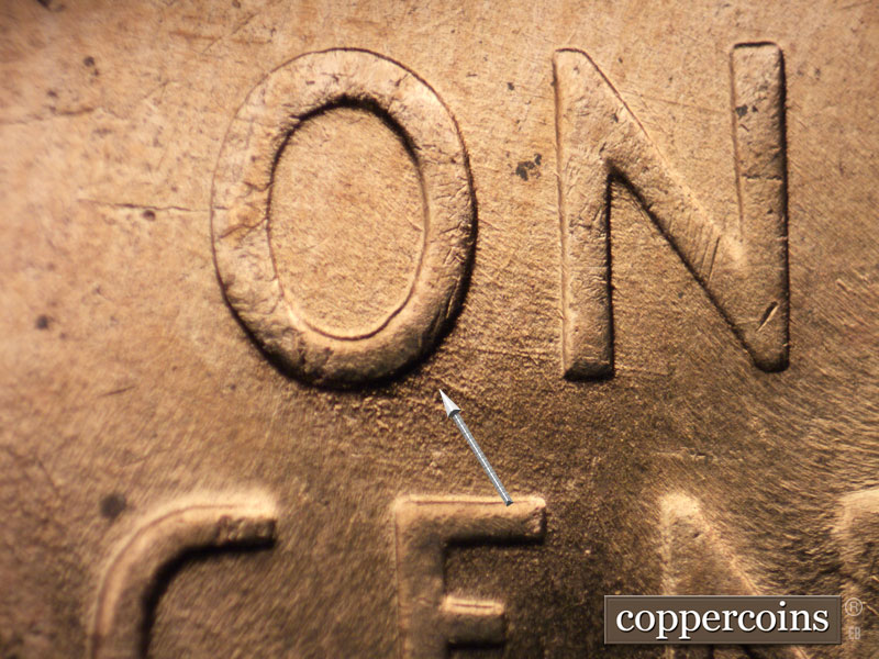Die-stage B marker on 1956D•1MM•013 (1956 Repunched Mint Mark).