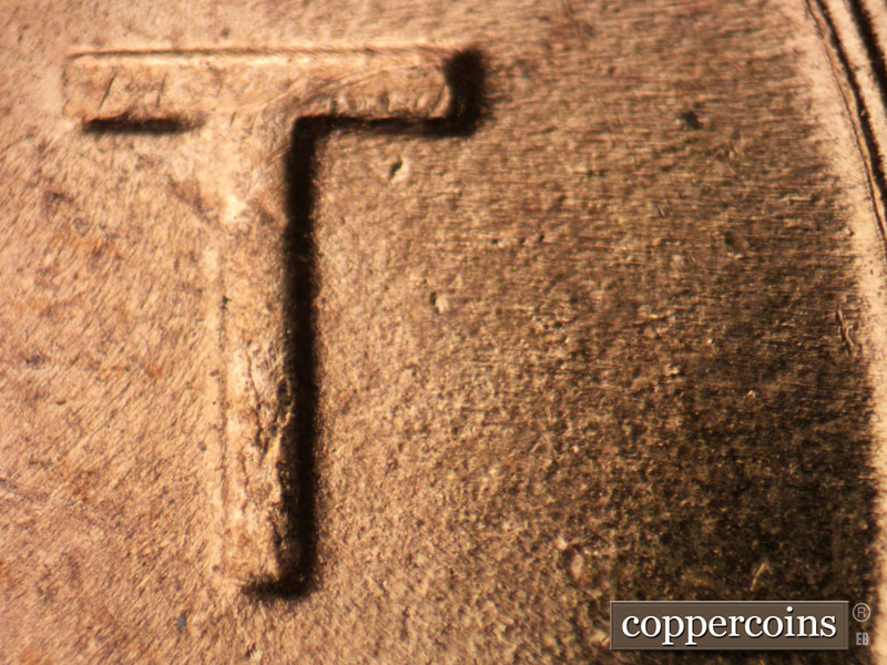 Die-stage B marker on 1956D•1MM•018 (1956 Repunched Mint Mark).