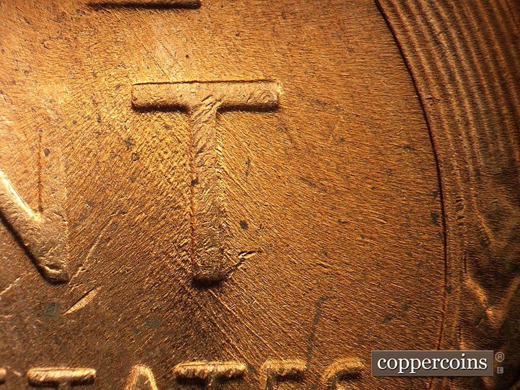 Die-stage C marker on 1956D•1MM•023 showing Heavier SE die scratches between T and TE in STATES.