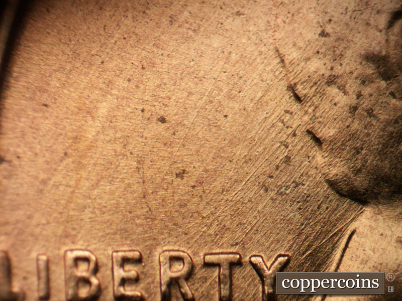 Die-stage B marker on 1956D•1MM•027 (1956 Repunched Mint Mark).