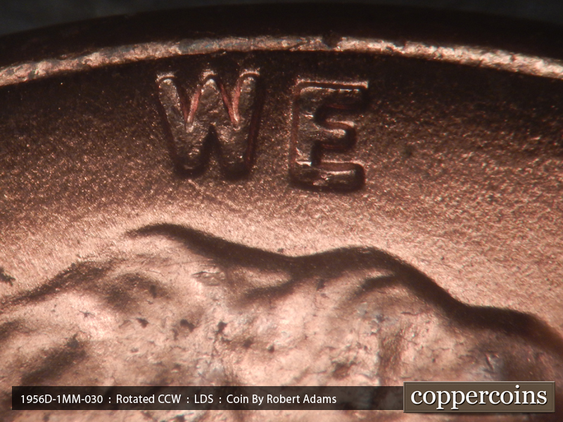 Die-stage C marker on 1956D•1MM•030 showing SE die scratchfrom W in WE.
