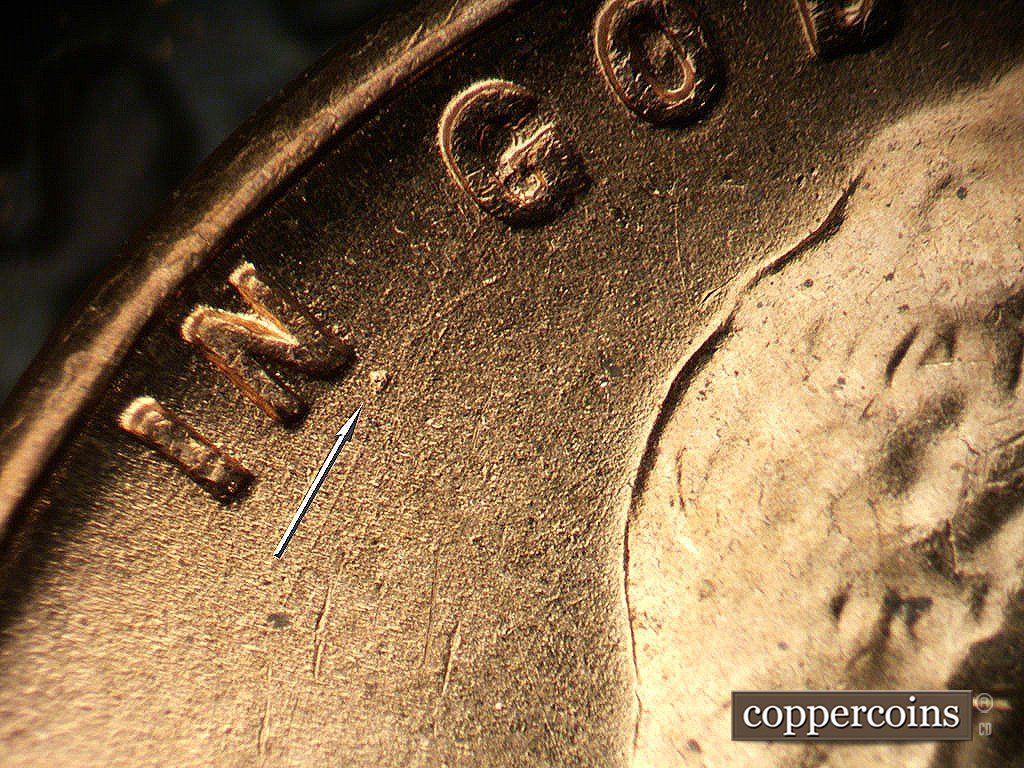 Die-stage B marker on 1956D•1MM•030 showing Die do under N of IN.