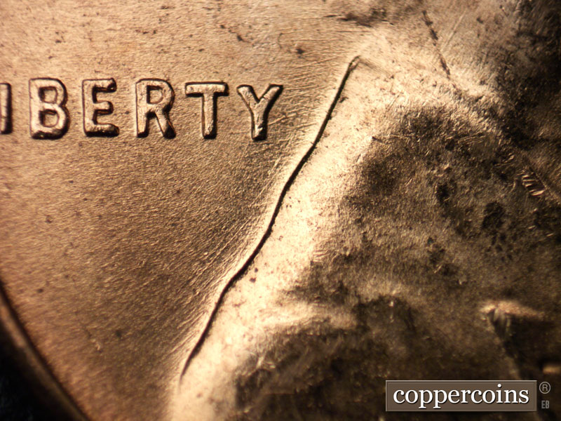 Die-stage B marker on 1956D•1MM•059 (1956 Repunched Mint Mark).