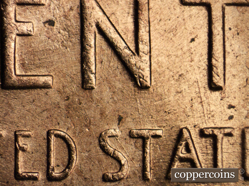 Die-stage B marker on 1956D•1MM•059 (1956 Repunched Mint Mark).