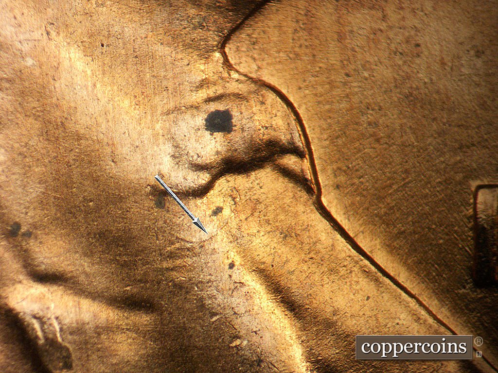 Die-stage A marker on 1956D•1MM•062 showing Curved Scratch or crack on lapel.