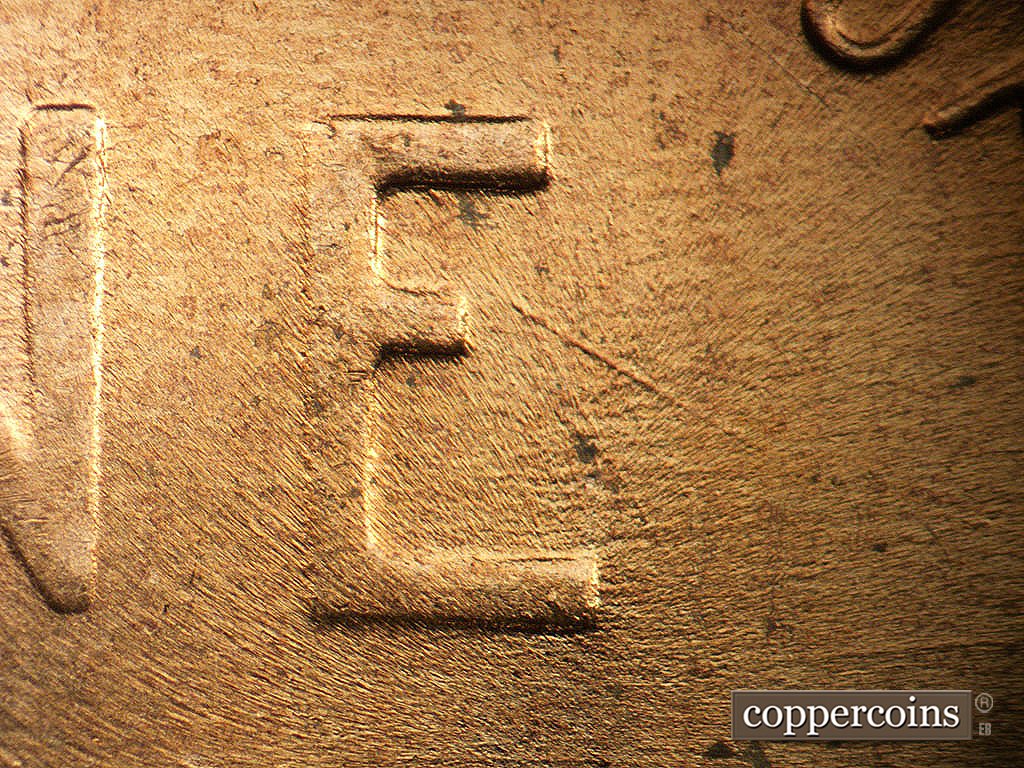 Die-stage A marker on 1956D•1MM•062 showing SE die scratch inside E of ONE.