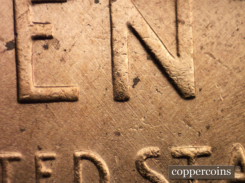 Die-stage B marker on 1956D•1MM•062 showing Light SE die scratches through EN of CENT.