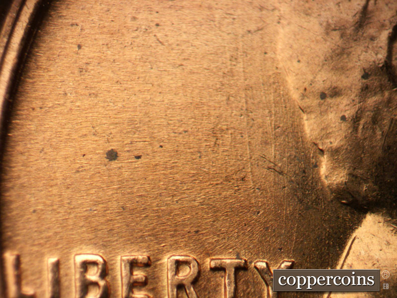 Die-stage B marker on 1956D•1MM•072 (1956 Repunched Mint Mark).