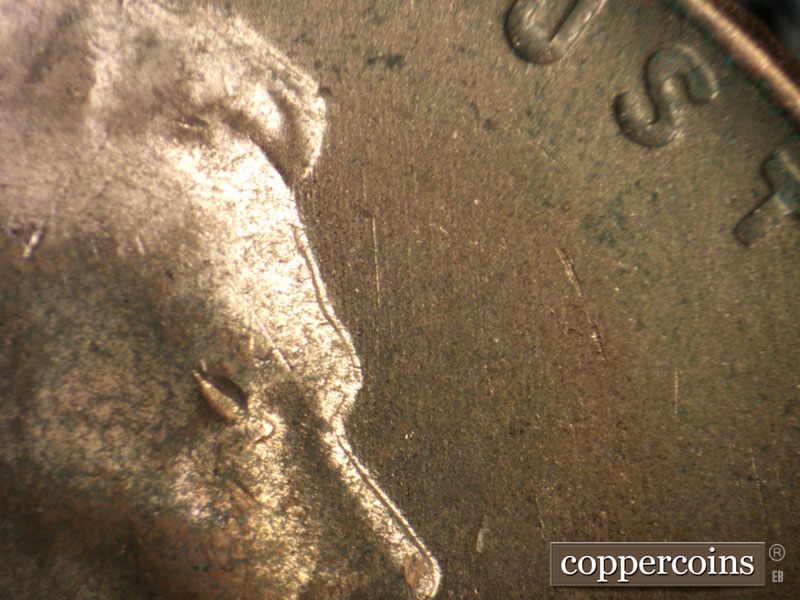 Die-stage B marker on 1956D•1MM•073 (1956 Repunched Mint Mark).