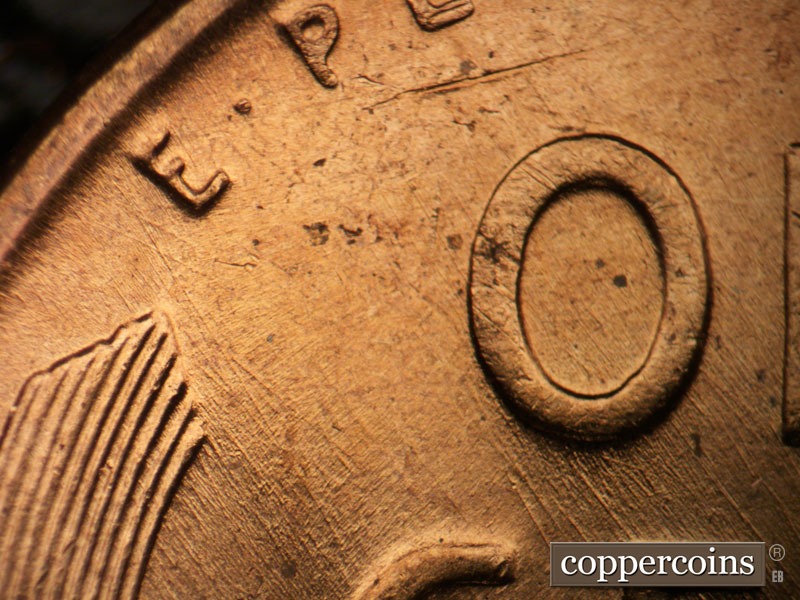 Die-stage B marker on 1956D•1MM•079 (1956 Repunched Mint Mark).