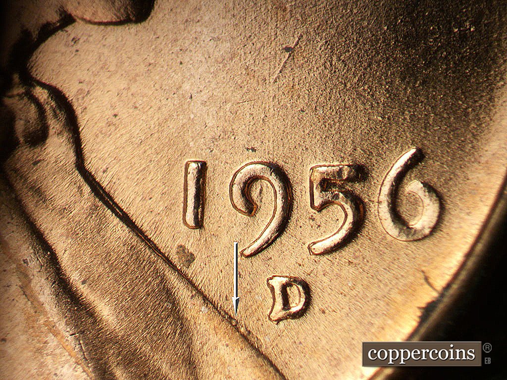 Die-stage B marker on 1956D•1MM•085 showing Die gouge near lapel, Light N/S die scratches above date.