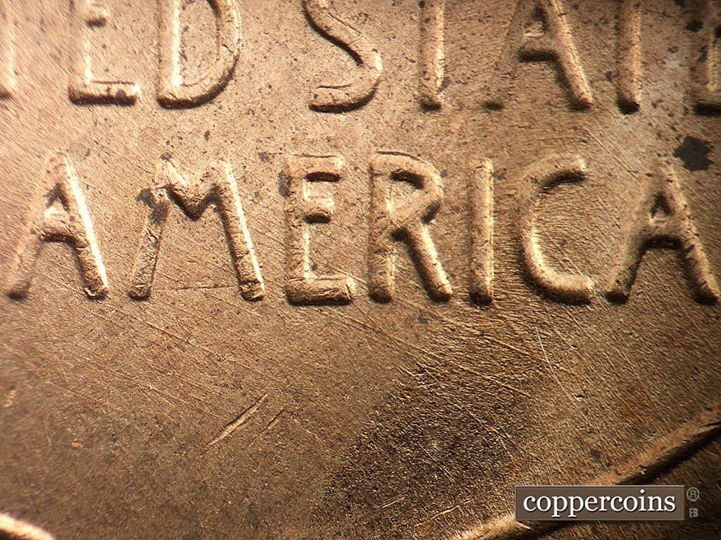 Die-stage B marker on 1956D•1MM•085 showing Die scratches through RICA in AMERICA.