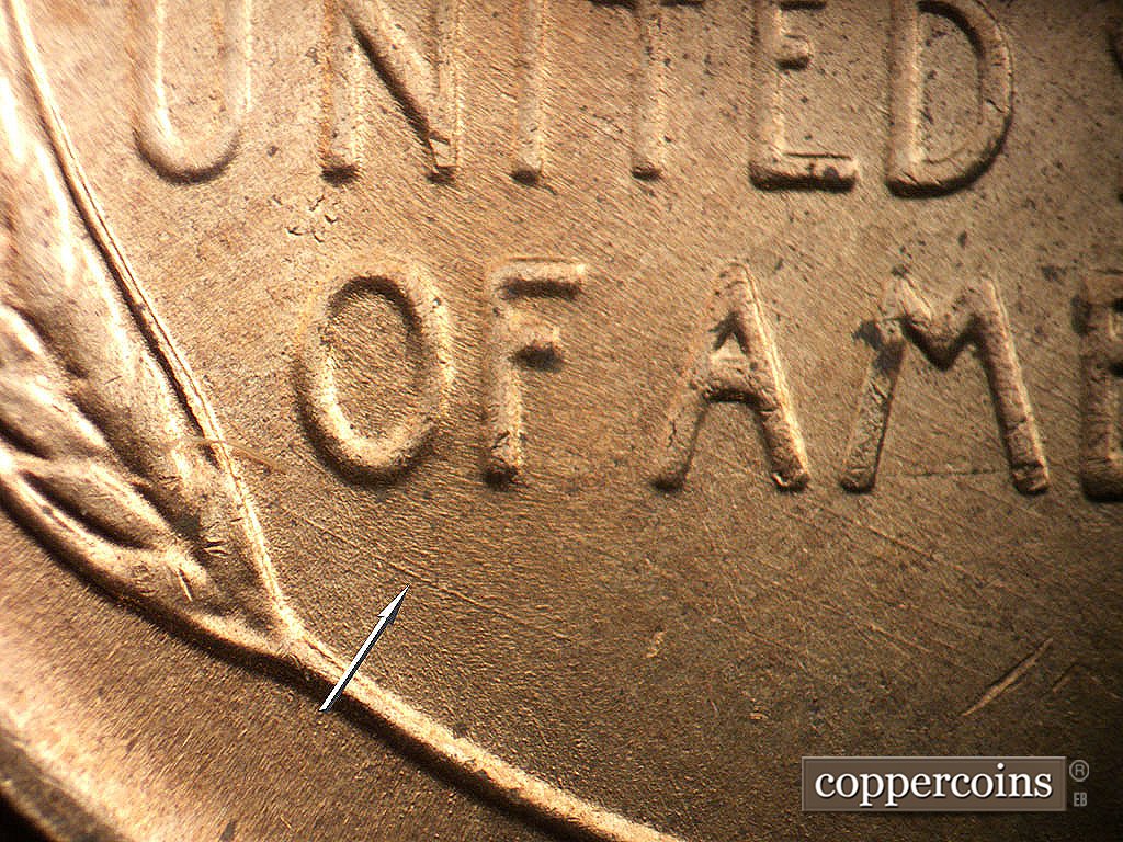Die-stage B marker on 1956D•1MM•085 showing SE die scratch from lower leftet wheat stalk under OF.