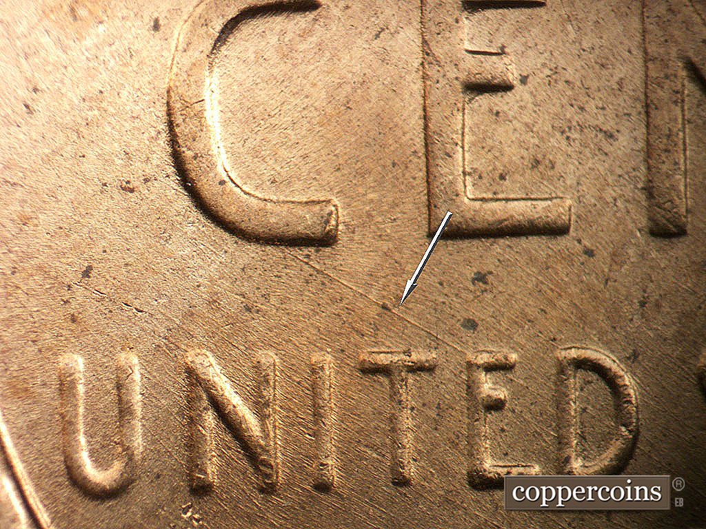 Die-stage B marker on 1956D•1MM•085 showing SE die scratch connect C in CENT to E in UNITED.