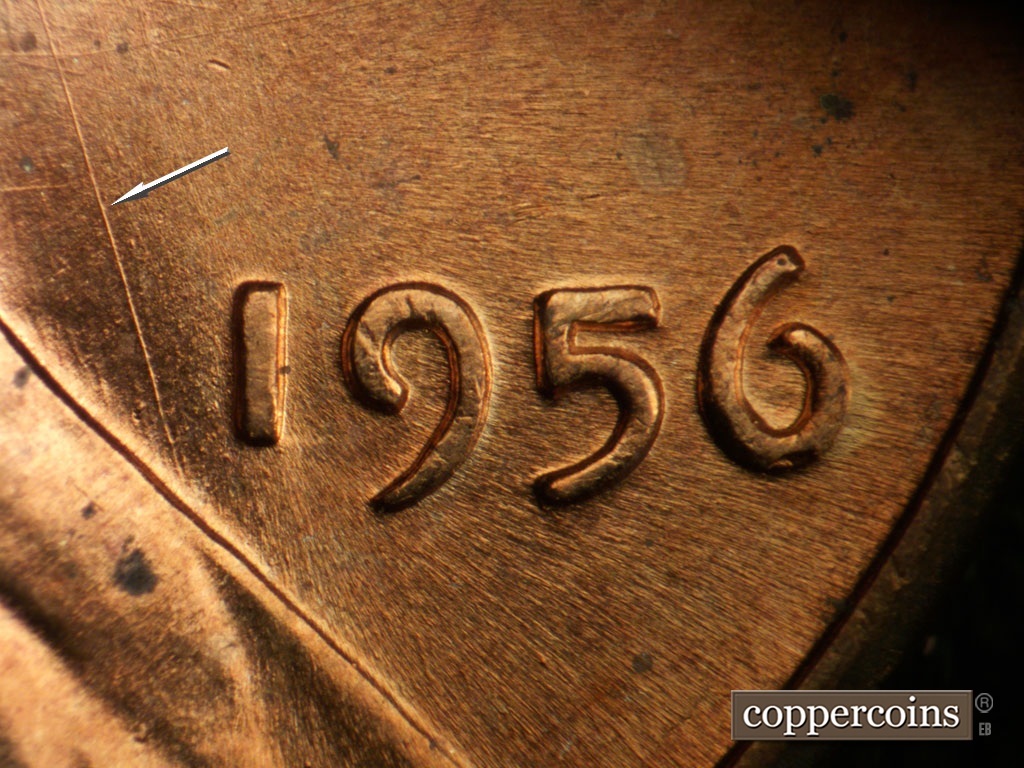 Die-stage B marker on 1956P•1DO•008 showing NNW die scratch from lapel up to beard.