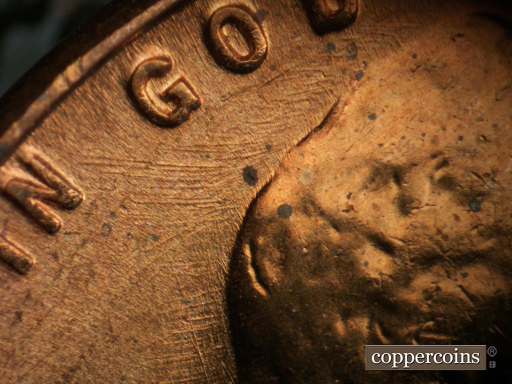 Die-stage B marker on 1956P•1DO•008 showing Die scratches throughout fiel near IN GOD.
