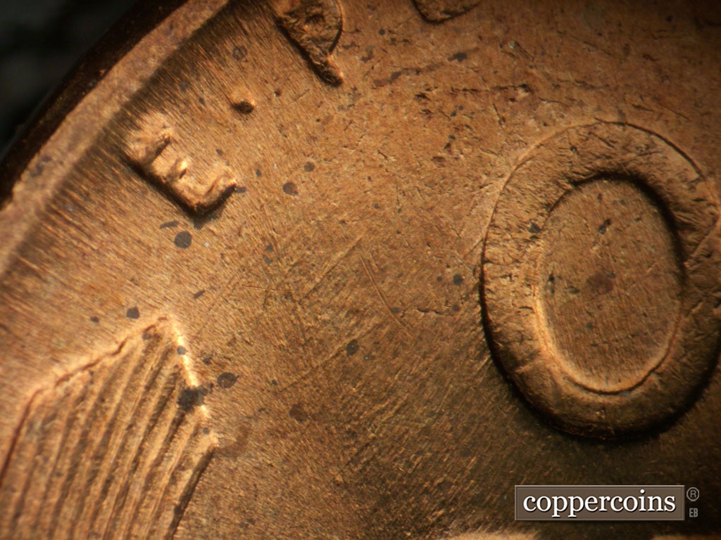 Die-stage B marker on 1956P•1DO•008 showing Die scratches in field of upper left reverse.