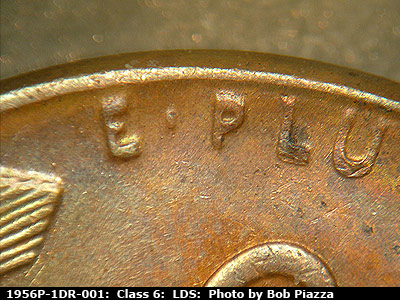 Die-stage C marker on 1956P•1DR•001 (1956 Doubled Die Reverse).