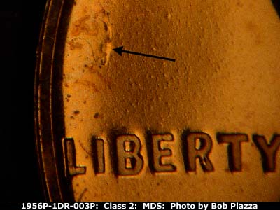 Die-stage B marker on 1956P•1DR•003P (1956 Doubled Die Reverse).