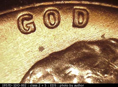 Die-stage A marker on 1957D•1DO•002 (1957 Doubled Die Obverse).