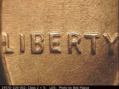 Die-stage C marker on 1957D•1DO•002 (1957 Doubled Die Obverse).