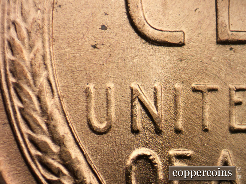 Die-stage B marker on 1957D•1DO•004 (1957 Doubled Die Obverse).