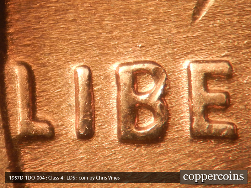 Die-stage C marker on 1957D•1DO•004 (1957 Doubled Die Obverse).