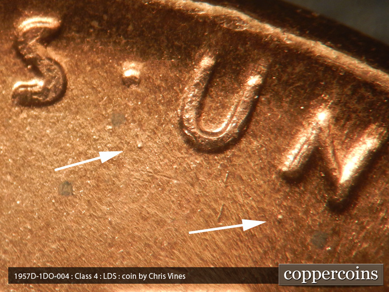 Die-stage C marker on 1957D•1DO•004 (1957 Doubled Die Obverse).