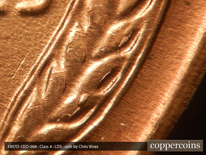 Die-stage C marker on 1957D•1DO•004 (1957 Doubled Die Obverse).