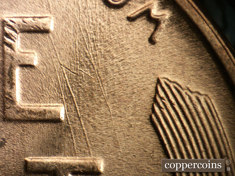 Die-stage B marker on 1957D•1DO•005 (1957 Doubled Die Obverse).