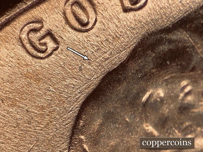 Die-stage C marker on 1957D•1DO•005 (1957 Doubled Die Obverse).