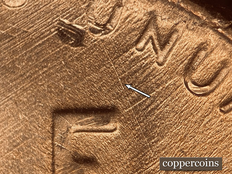 Die-stage C marker on 1957D•1DO•005 (1957 Doubled Die Obverse).
