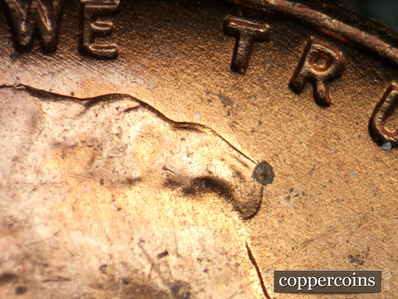 Die-stage A marker on 1957D•1DO•006 (1957 Doubled Die Obverse).