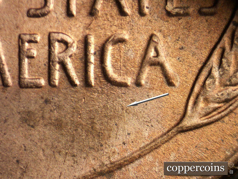 Die-stage A marker on 1957D•1DO•006 (1957 Doubled Die Obverse).