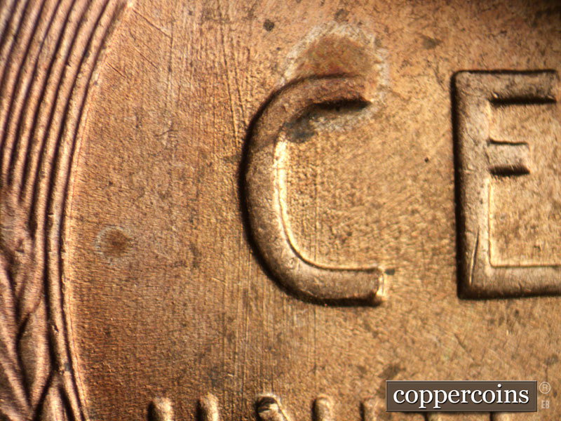Die-stage A marker on 1957D•1DO•006 (1957 Doubled Die Obverse).