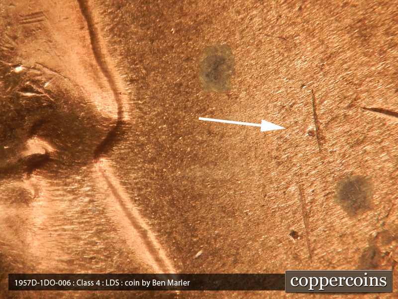 Die-stage C marker on 1957D•1DO•006 (1957 Doubled Die Obverse).