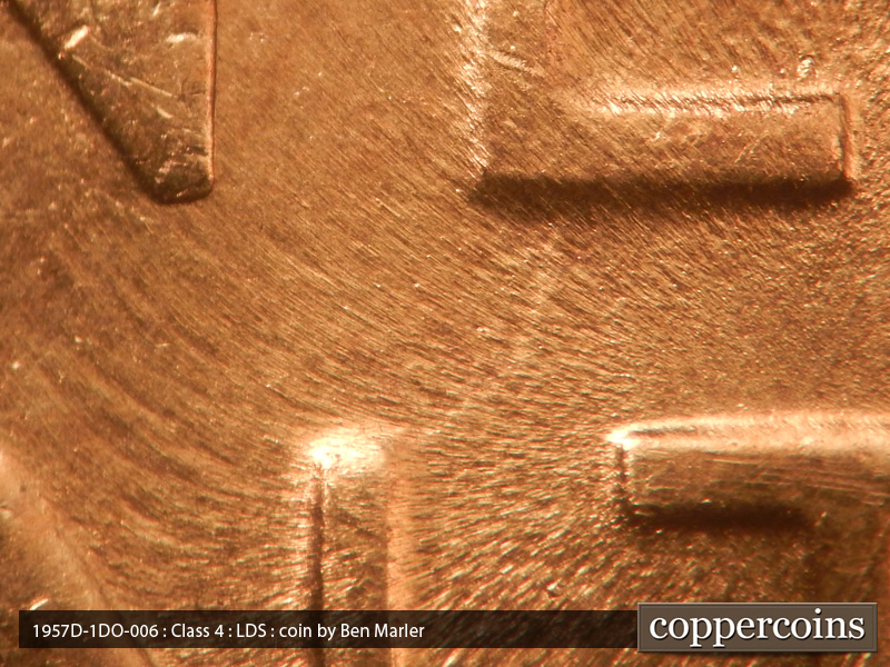 Die-stage C marker on 1957D•1DO•006 (1957 Doubled Die Obverse).