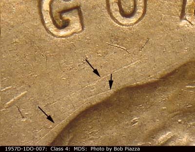 Die-stage B marker on 1957D•1DO•007 (1957 Doubled Die Obverse).
